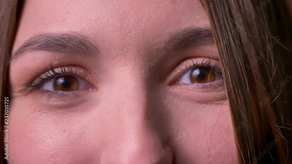 Closeup portrait of woman eyes who opens eyes and watchies directly into camera expressing enjoyment. Closeup portrait of woman eyes who opens eyes and watchies directly into camera expressing enjoyment.