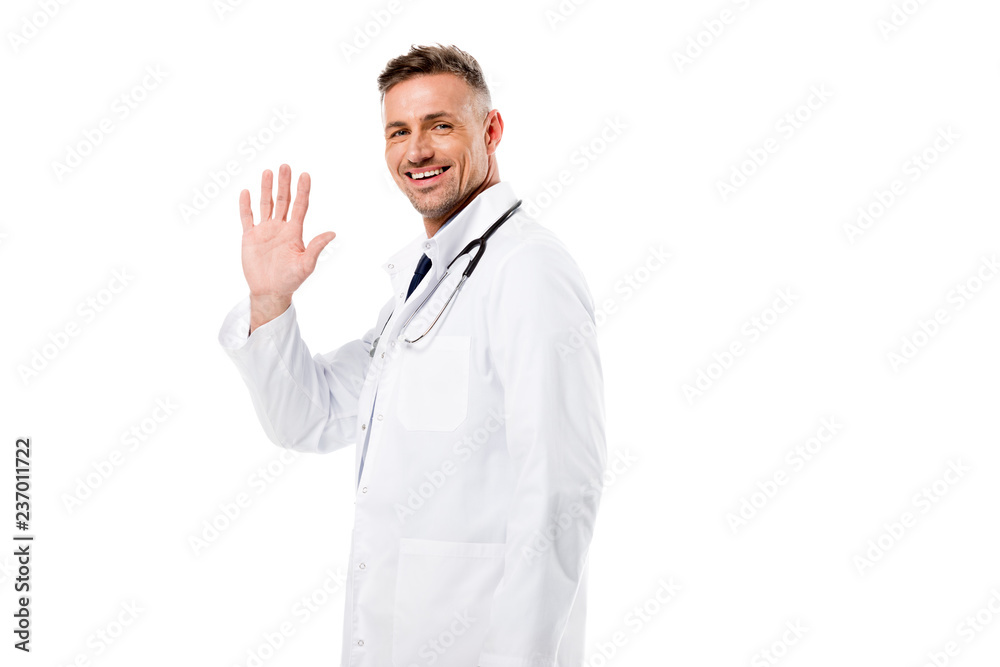 handsome doctor waving and looking at camera isolated on white handsome doctor waving and looking at camera isolated on white