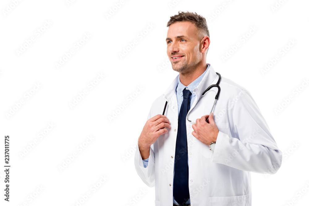handsome doctor in white coat with stethoscope looking away isolated on white