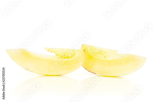 Group of two slices of fresh striped pepino melon isolated on white background
