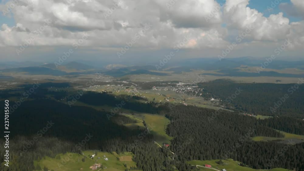 Aerial shot: slow flight towards town of Aerial shot: slow flight towards town of