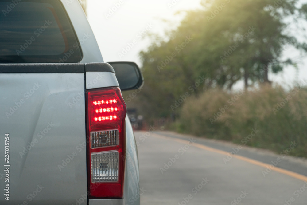 Pick up car break on the concrete road by traffic jam in rush hours on day.