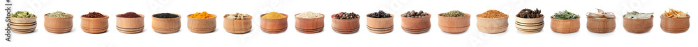 Wooden bowls with different spices and herbs on white background. Large collection Wooden bowls with different spices and herbs on white background. Large collection