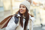 Enjoy christmas shopping. Winter shopping. Young woman with shopping bags
