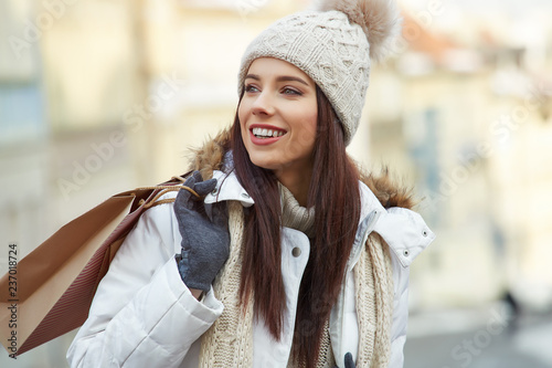 Enjoy christmas shopping. Winter shopping. Young woman with shopping bags