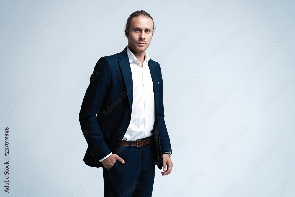 Portrait of handsome man in dark blue suit. Portrait of handsome man in dark blue suit.