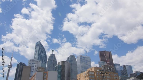 Time lapse clouds with blue sky over Toronto skyline. photo