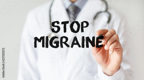 Doctor writing word Stop Migraine with marker, Medical concept