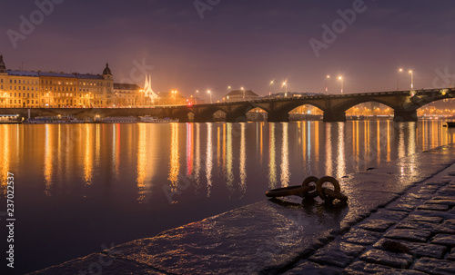 Foggy night over Prague near the Palackeho bridge and vltava river