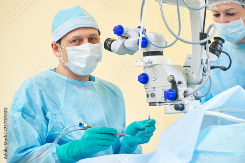 doctor ophthalmologist surgeon in operation room