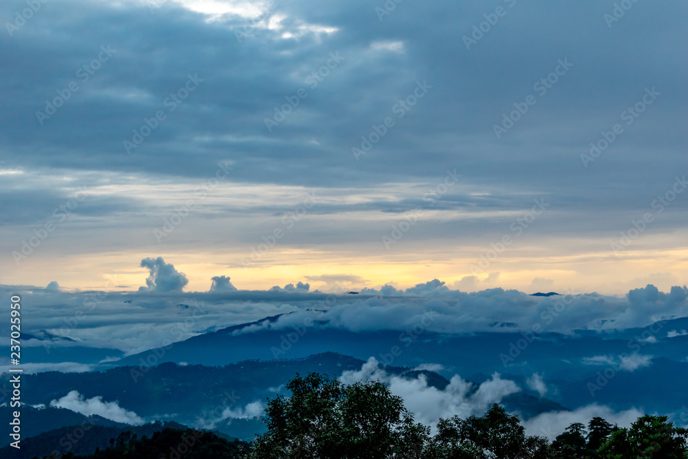 watching the sunset sky from the top of the Binsar Wildlife Sanctuary, from Dak Bunglow, rainy season