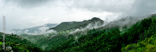 clouds floating over the mountain range as seen while driving to Binsar, near Almora, Uttarakhand,. rainy season, monsoon India photo