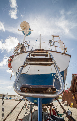 Poop of Sailboat moored on dry dock photo