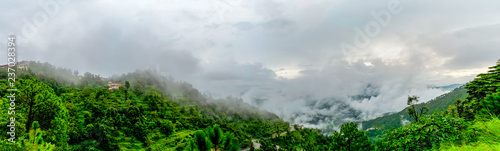clouds floating over the mountain range as seen while driving to Binsar, near Almora, Uttarakhand,. rainy season, monsoon India photo