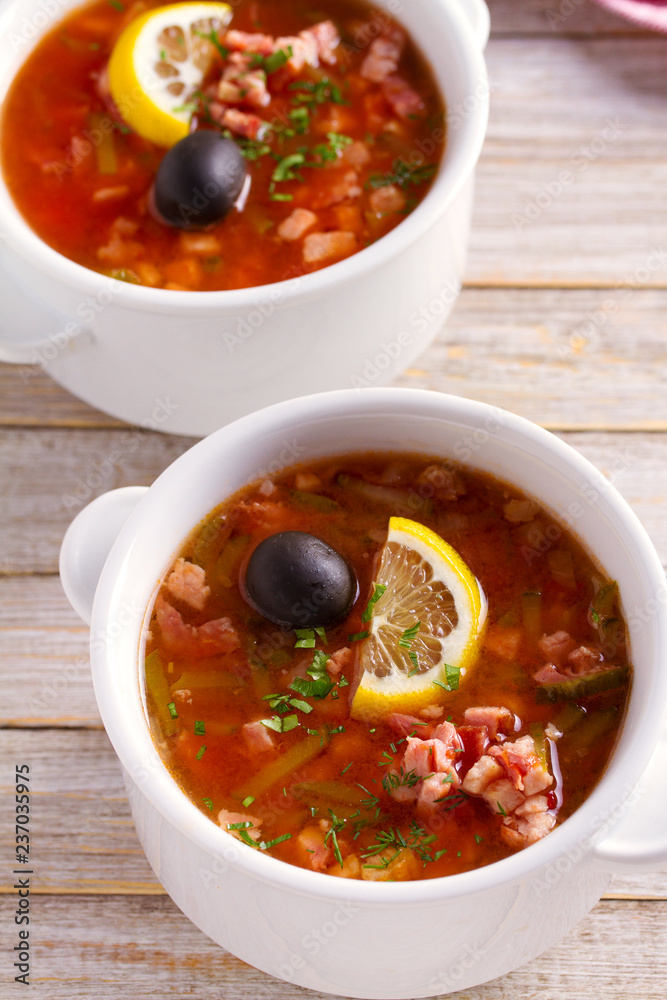 Traditional Russian dish solyanka - thick, spicy and sour saltwort soup Traditional Russian dish solyanka - thick, spicy and sour saltwort soup