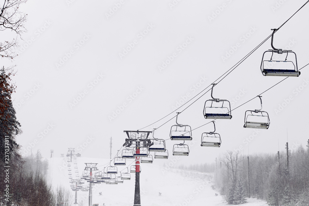 Empty Ski lift on mountains background. Bormio, Italy Empty Ski lift on mountains background. Bormio, Italy