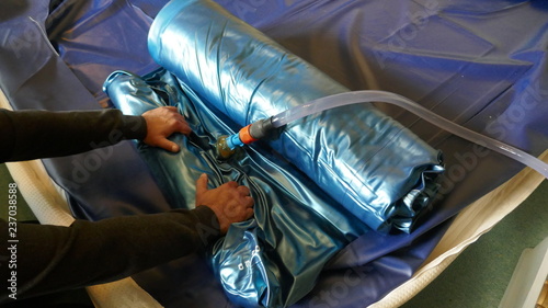 Bilde på lerret Emptying and dismantling a PVC waterbed mattress