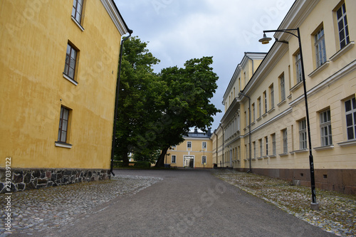 Yellow, old buildings and streets in Suomenlinna Sea Fortress, a UNESCO World Heritage Site, in Finland.