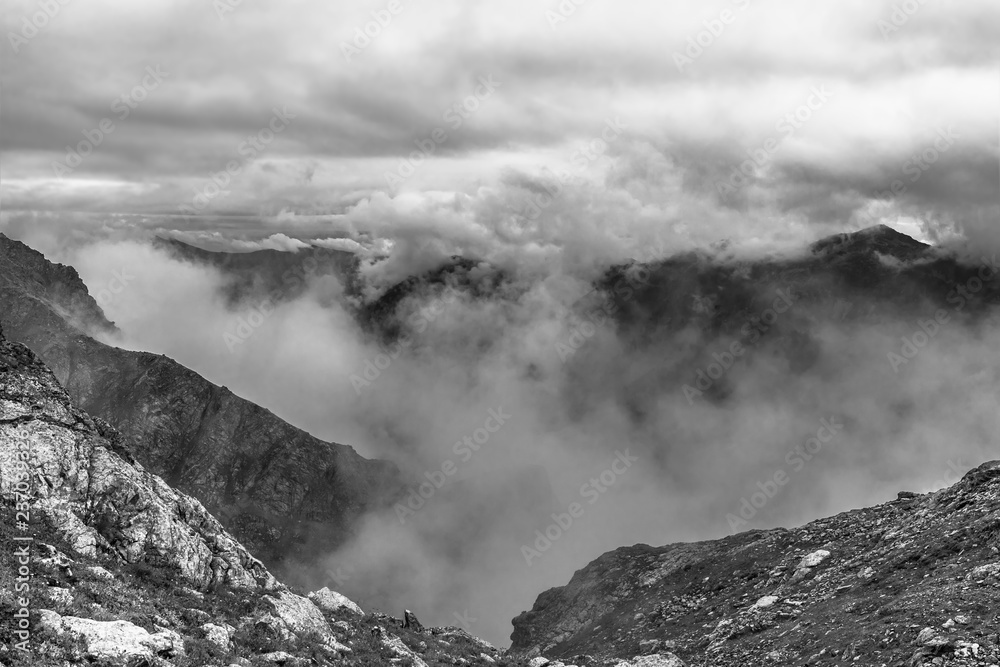 Black and white. View of the mountain peaks at the large Sofia lakes. 2800m. Arkhyz KCR, Russia. Black and white. View of the mountain peaks at the large Sofia lakes. 2800m. Arkhyz KCR, Russia.