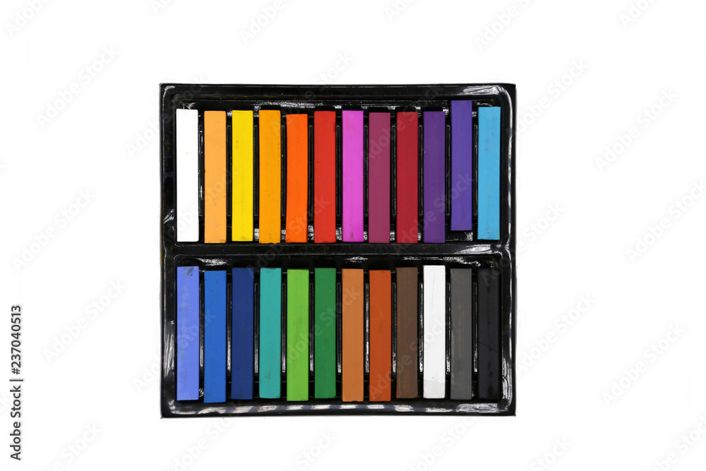 Chalk pastels, soft crayons in black box isolated on white. Top view. Stock  Photo | Adobe Stock