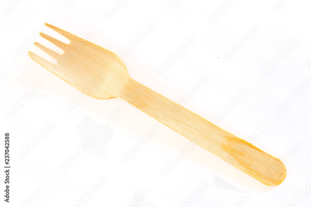 Wooden fork on white background Wooden fork on white background