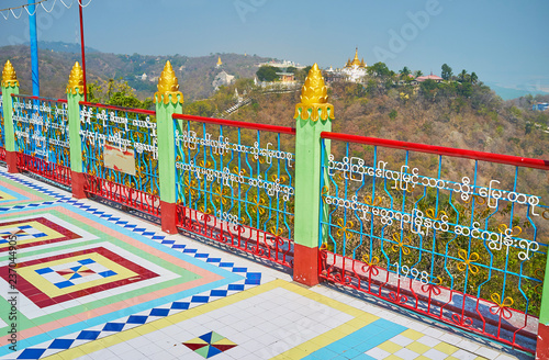 SAGAING, MYANMAR - FEBRUARY 21, 2018: Walk along the terrace of Soon Oo Ponya Shin Paya (Summit Pagoda) and enjoy the landscapes, beautiful nature and old pagodas, on February 21 in Sagaing photo