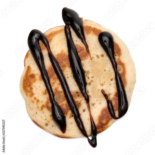 One pancake with chocolate syrup isolated on white background cutout.