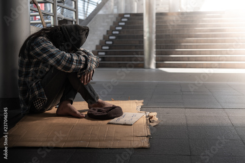 Beggars, Homeless people sitting on the floor Get close to ban, ask for a fraction of money from people travelng to buy food to live, to homeless concept.