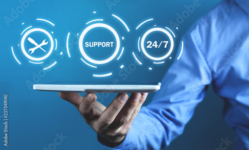 Man holding tablet. 24/7 Support Service