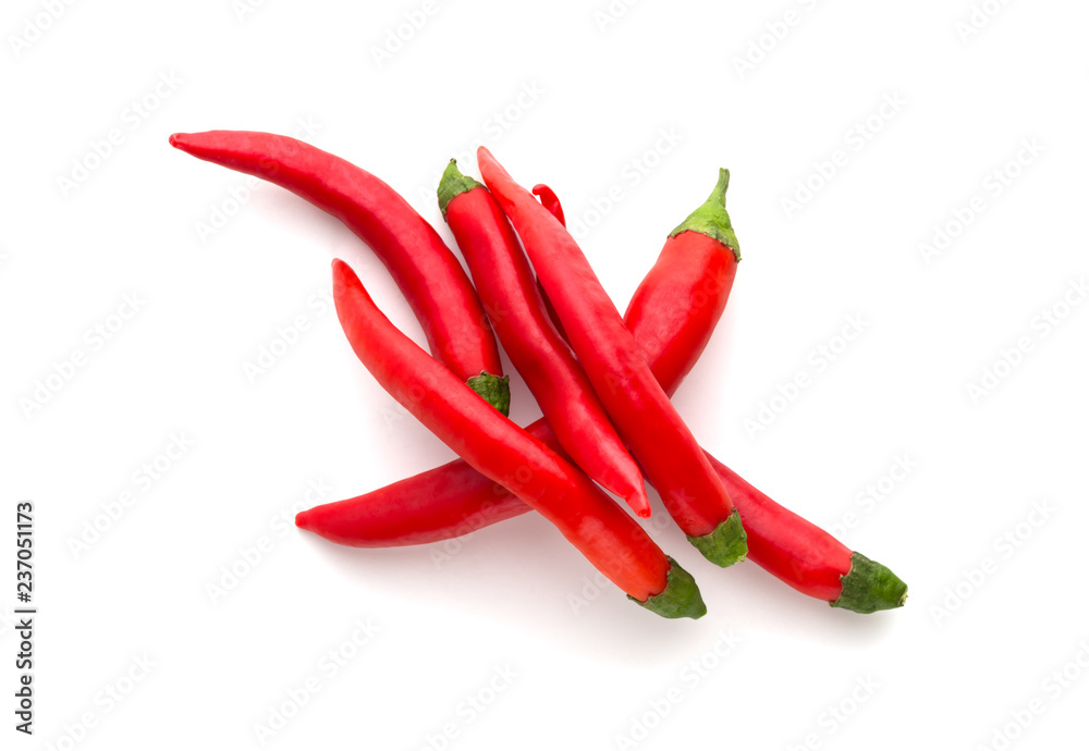 Chili peppers on a white background. A few fresh red peppers on a white background.