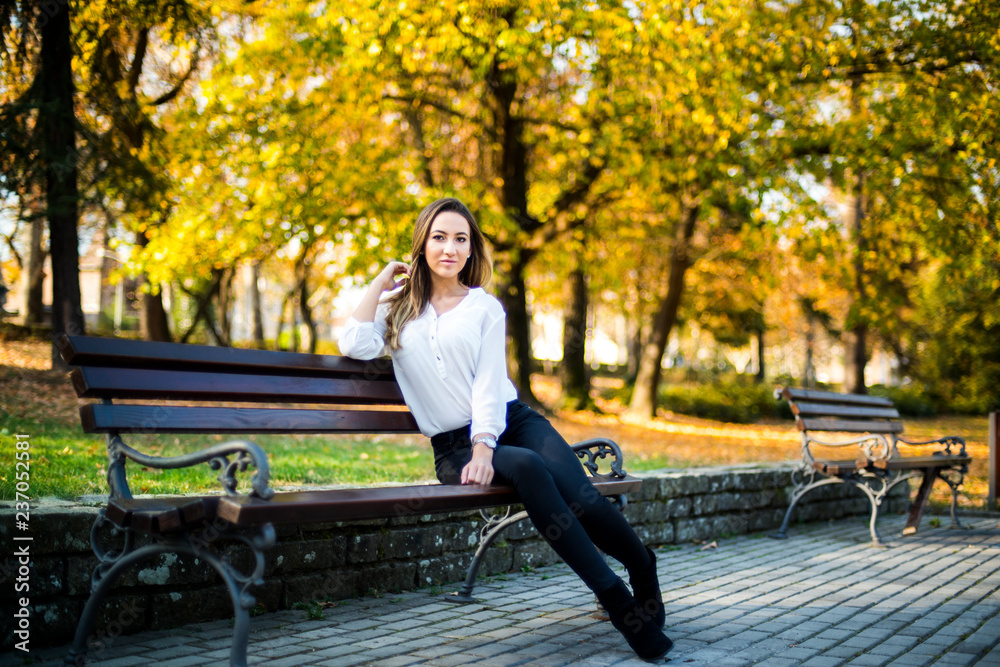Photographing a girl during autumn with a blurred background Photographing a girl during autumn with a blurred background