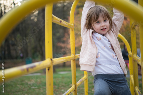 cute little girl  having fun in playground