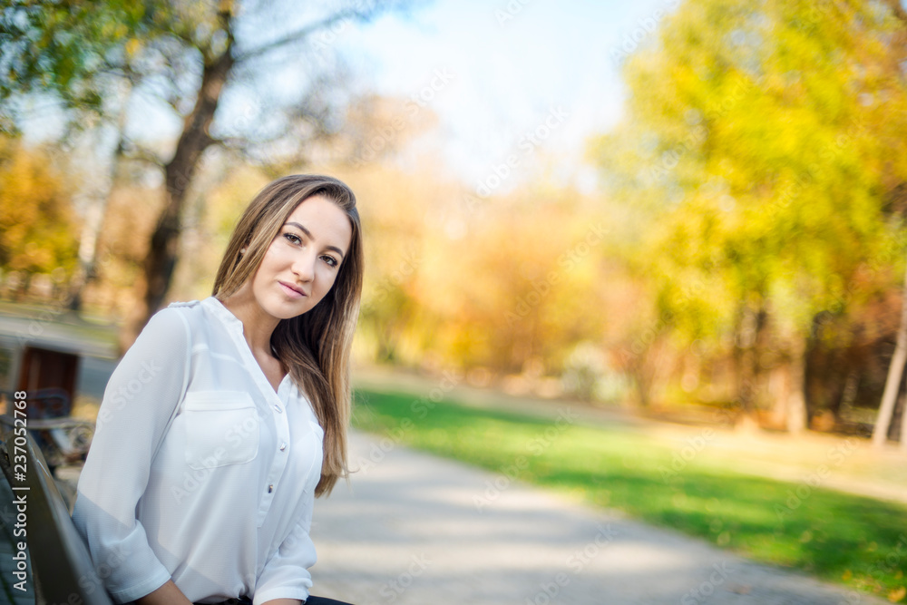 Photographing a girl during autumn with a blurred background Photographing a girl during autumn with a blurred background