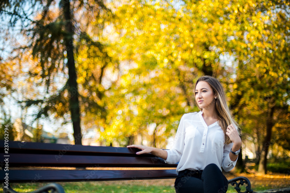 Photographing a girl during autumn with a blurred background Photographing a girl during autumn with a blurred background