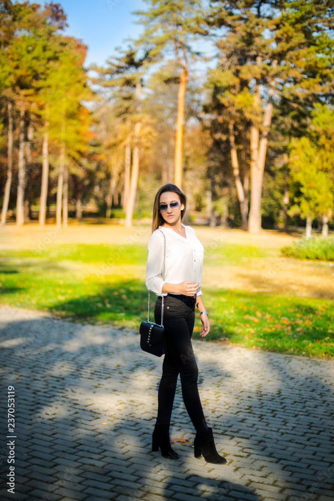 Photographing a girl during autumn with a blurred background Photographing a girl during autumn with a blurred background