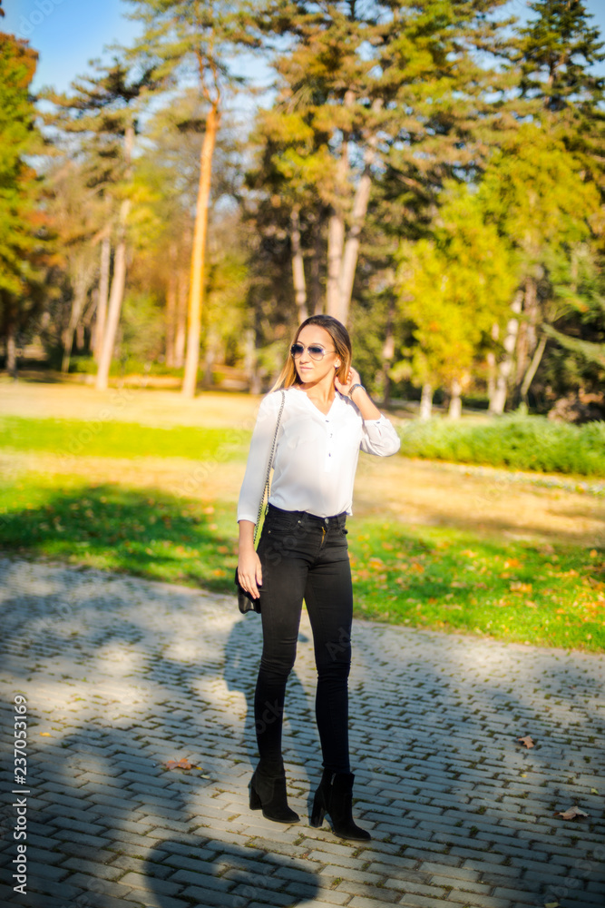 Photographing a girl during autumn with a blurred background Photographing a girl during autumn with a blurred background