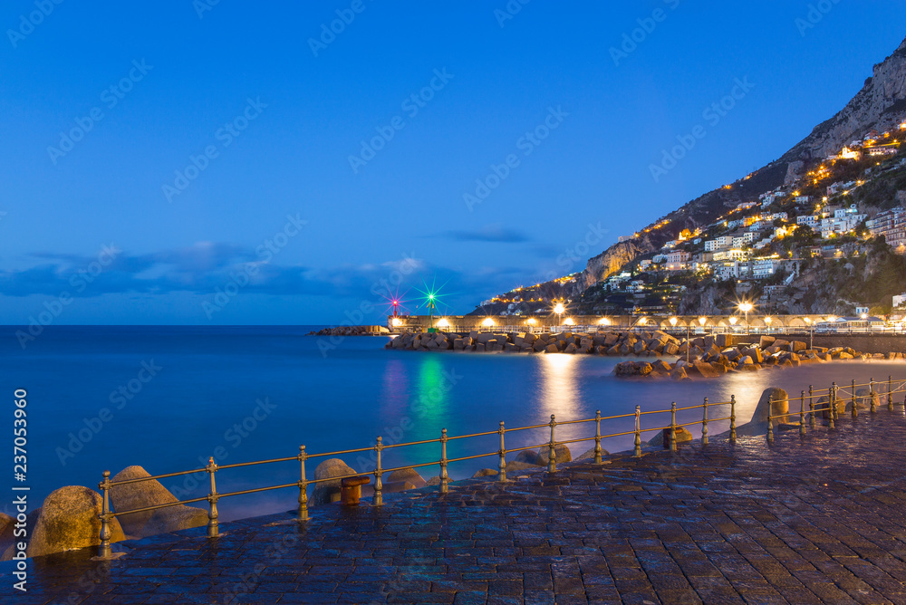 lights of port lighthouse and coast houses in Amalfi in Italy