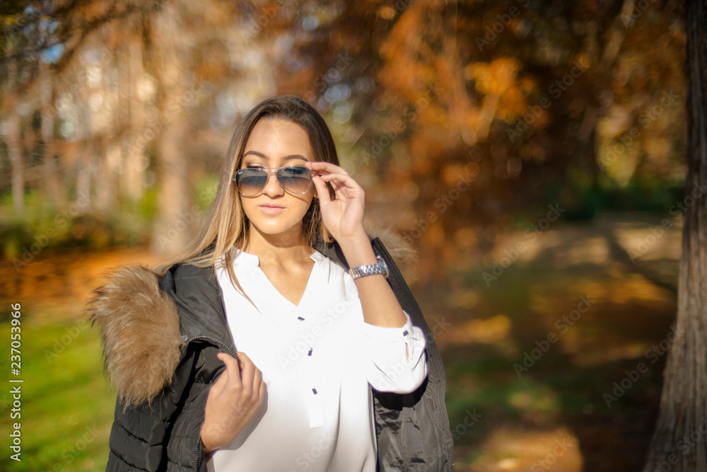 Photographing a girl during autumn with a blurred background Photographing a girl during autumn with a blurred background