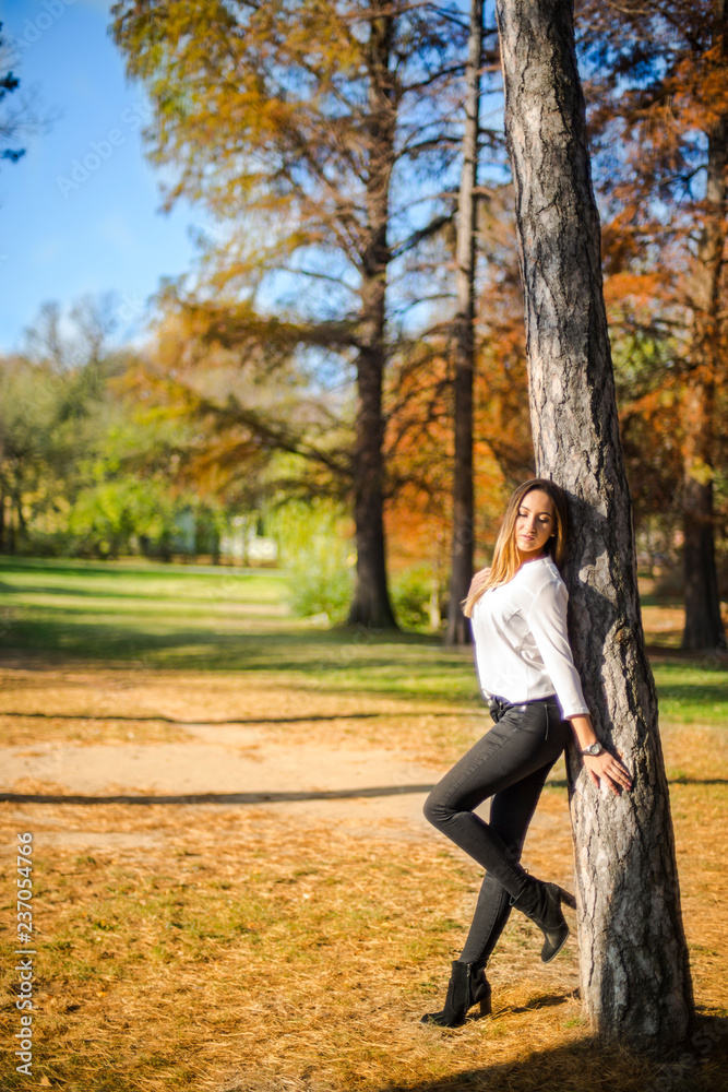 Photographing a girl during autumn with a blurred background Photographing a girl during autumn with a blurred background