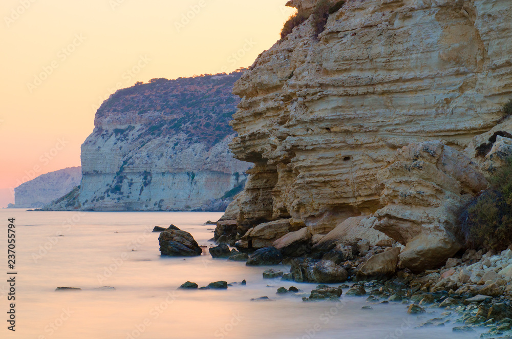 Sunset behind rock cliffs