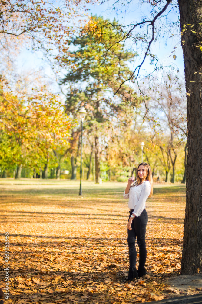 Photographing a girl during autumn with a blurred background Photographing a girl during autumn with a blurred background