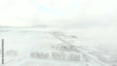 Wallpaper Mural Descending through fog to snowy fields and tree line-Aerial Torontodigital.ca