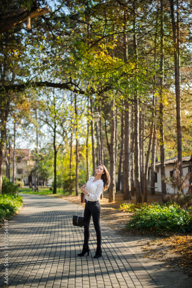 Photographing a girl during autumn with a blurred background Photographing a girl during autumn with a blurred background
