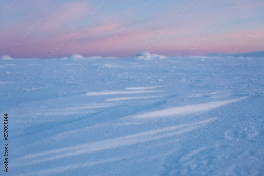 Snow desert at sunrise. Northern Ural mountains, Russia