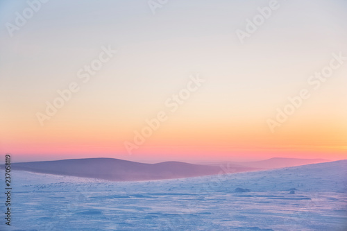Snow desert at sunrise. Northern Ural mountains, Russia