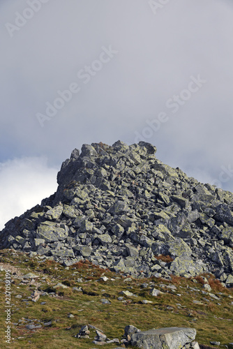 mountain meadow and stony hill summit of Derese mountain peak in Nizke Tatry mountains in Slovakia photo
