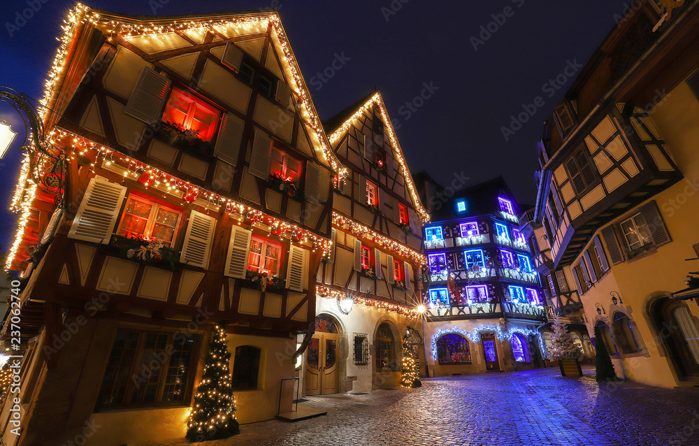 Traditional Alsatian half-timbered houses in old town of Colmar, decorated for christmas time, Alsace, France
