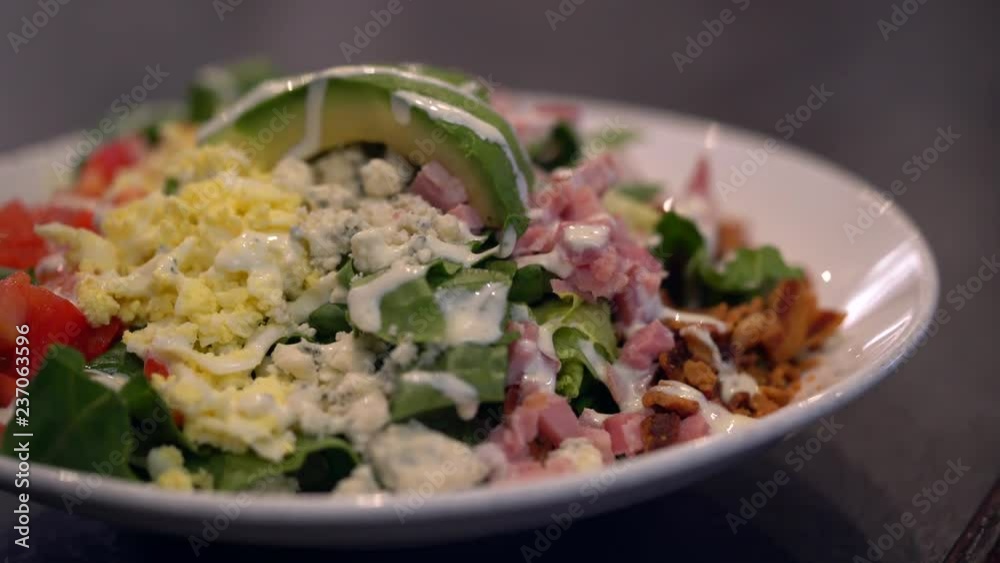 Slider shot of delicious salad in restaurant Slider shot of delicious salad in restaurant