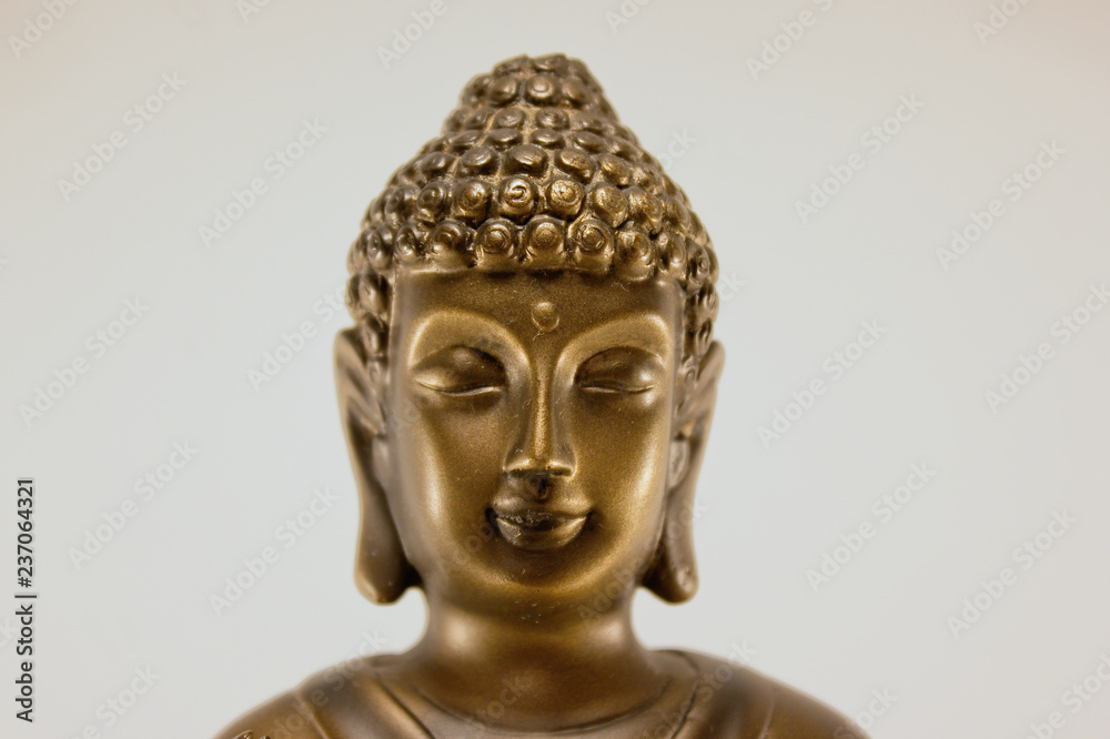 Head of friendly and peaceful Buddah isolated on a white background