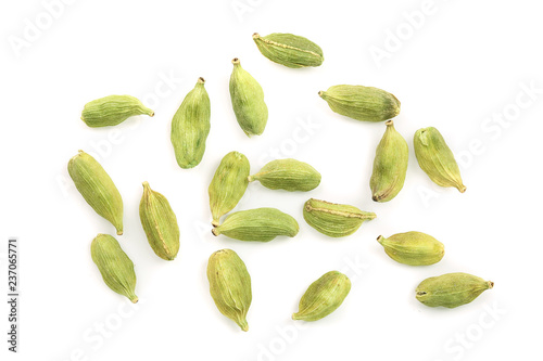 Green cardamom seeds isolated on white background. Top view. Flat lay photo